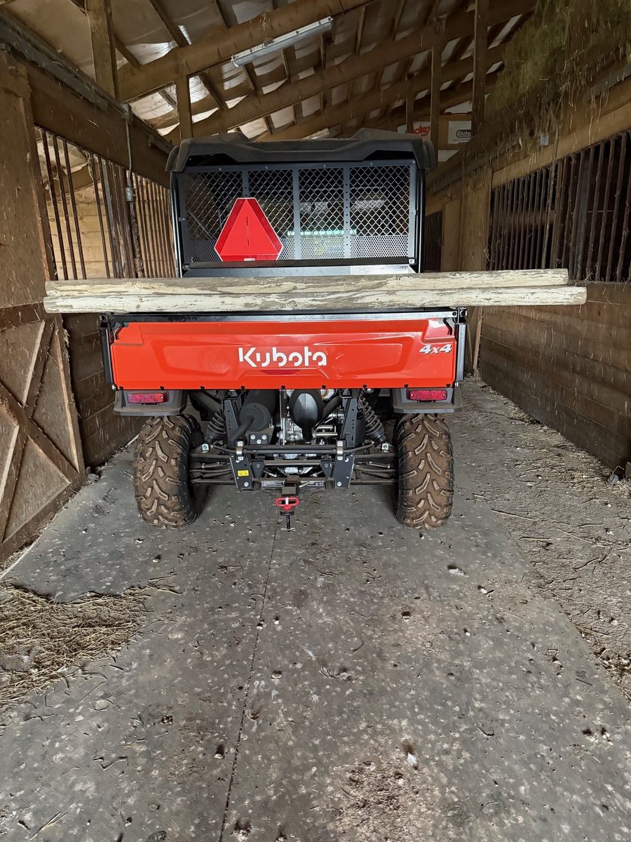 Kubota RTV utility vehicle inside a horse barn