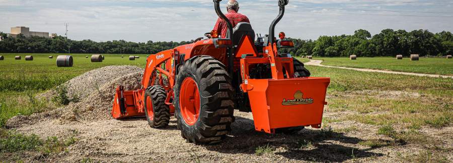 Kubota L Series tractor working on a farm