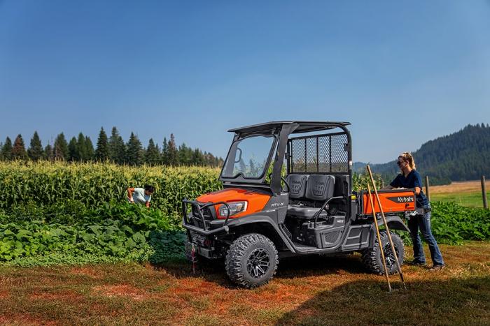 Kubota RTV-X1130 diesel utility vehicle parked beside a cornfield