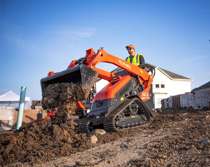 Kubota SCL1000 stand-on compact track loader with a 42-inch smooth bucket